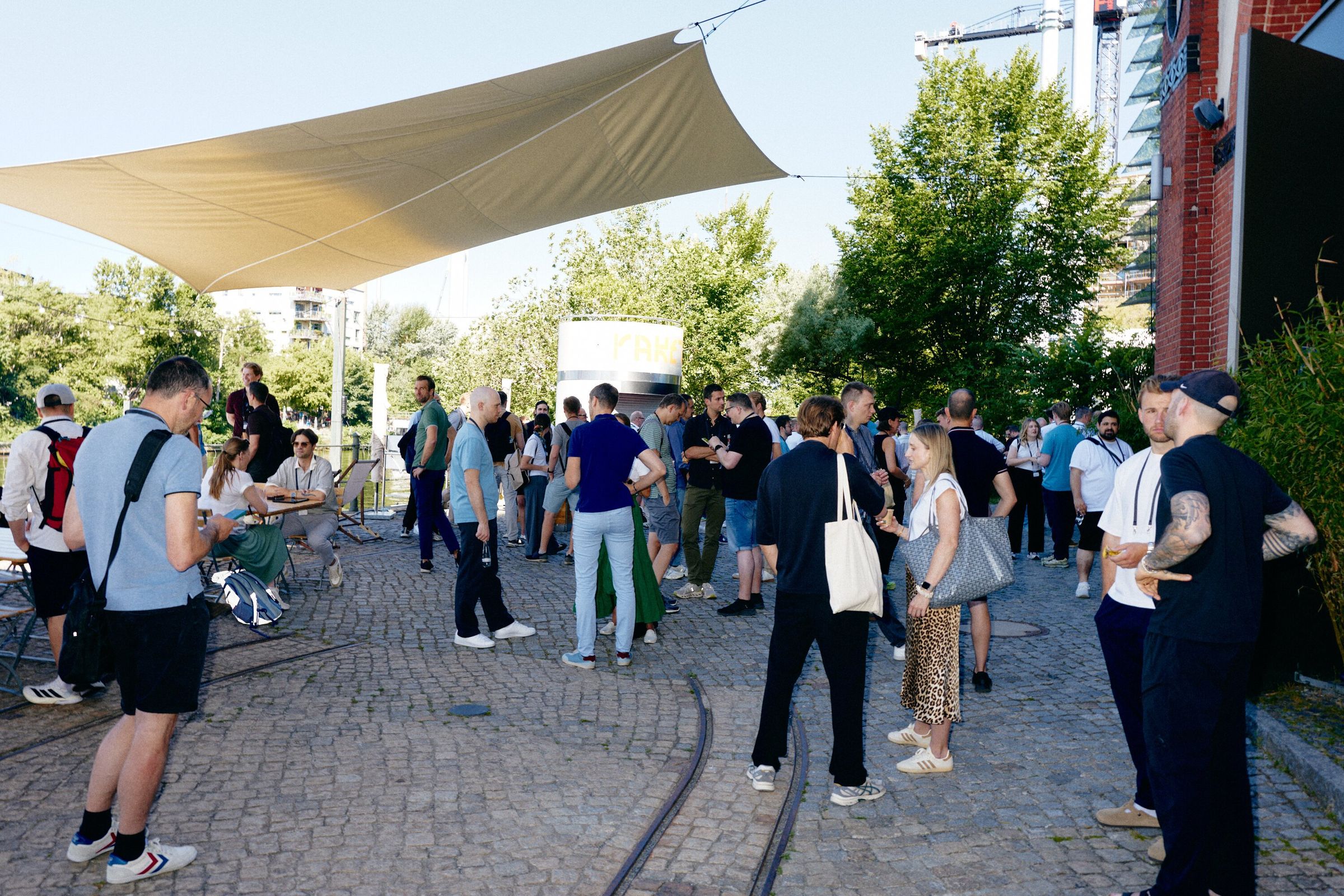 Guests arriving and talking outside The Dock in June 2026